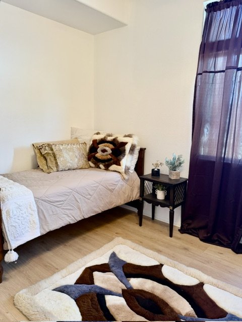 A quiet, welcoming corner of a bedroom at Wisteria RALF.