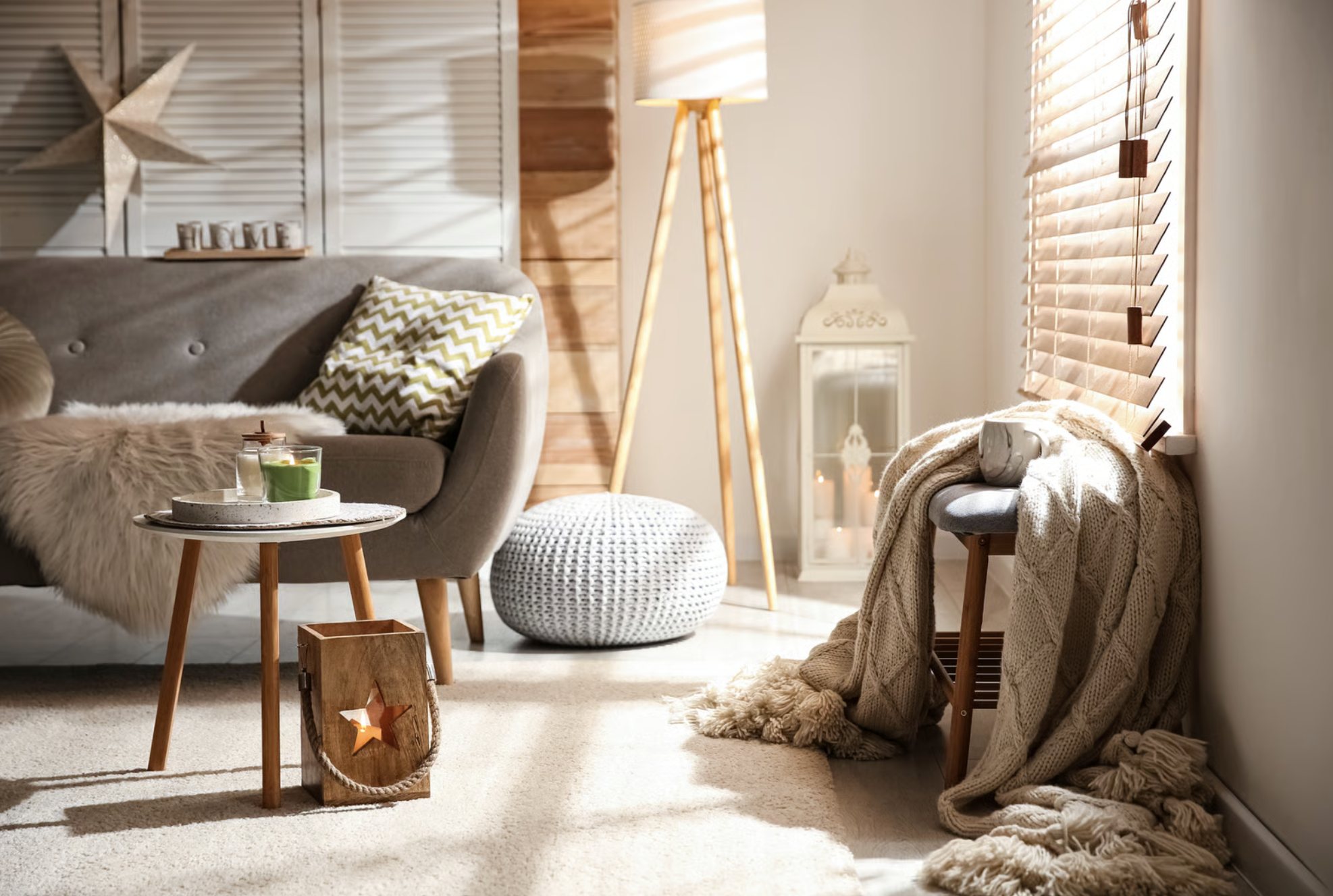 A cozy, sunlit living room corner with a knit throw.