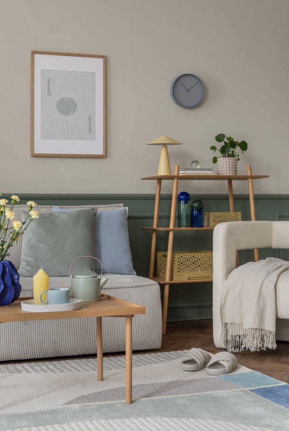 A calm living room with soft blue and green tones.